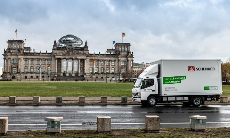 An electric truck in front of the Reichstag building in Berlin.