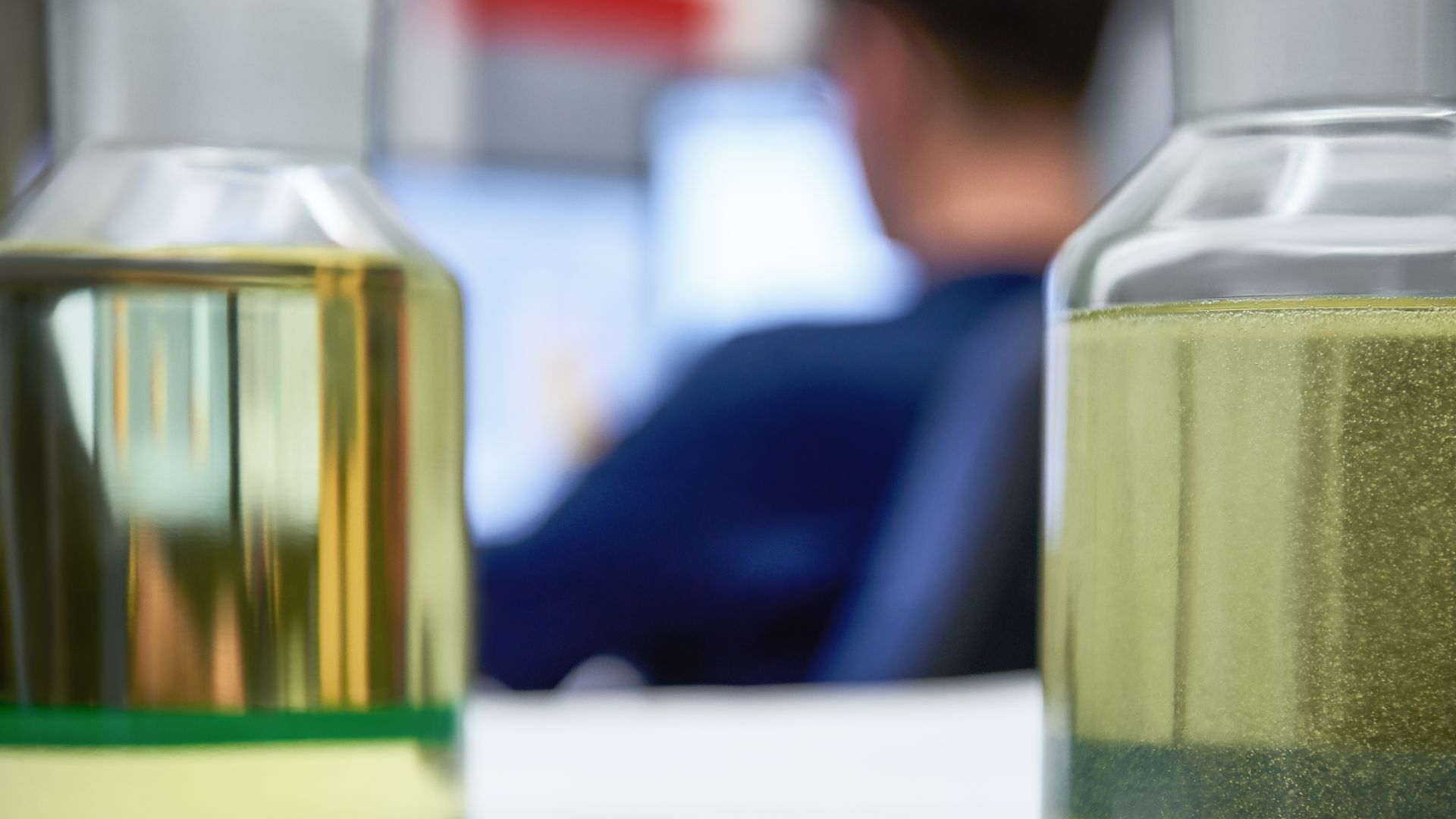  Two jars of oil during the special filtering process.