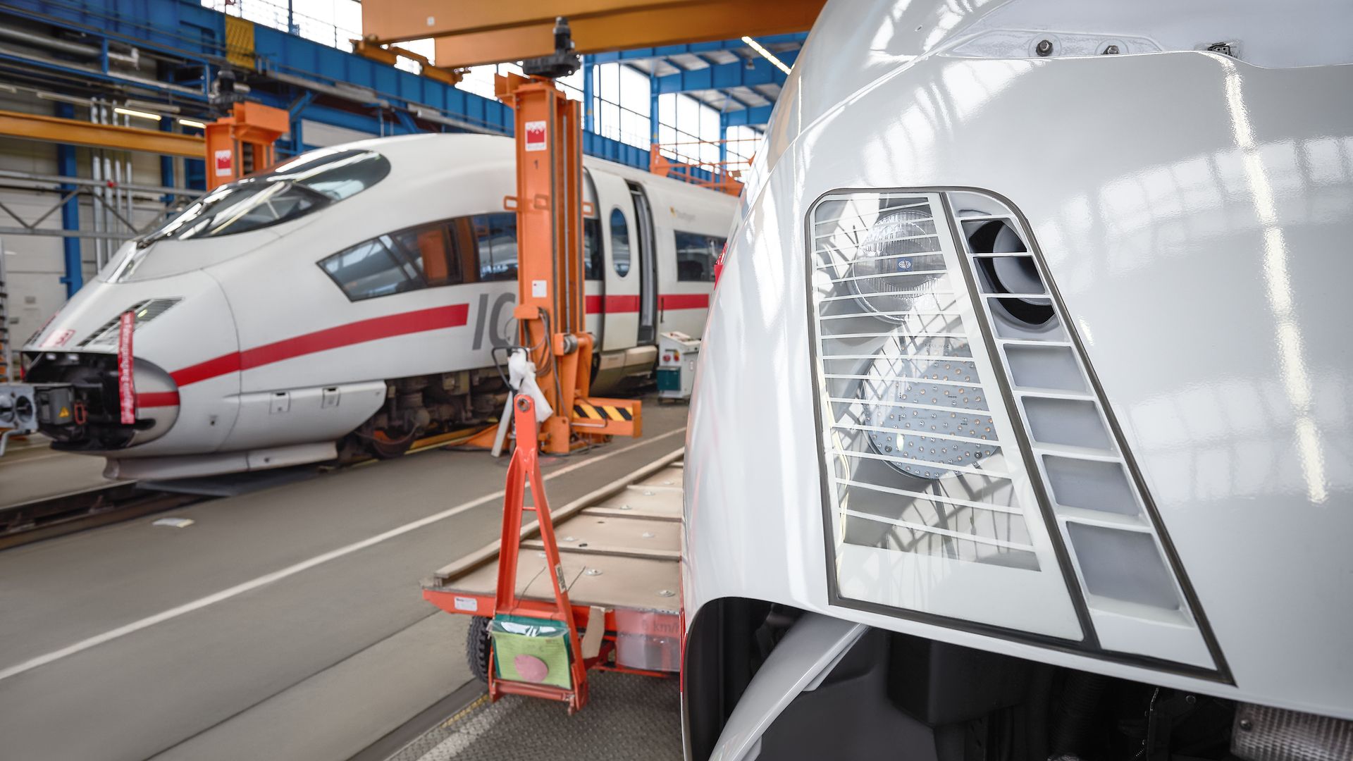 Two ICE multiple units in a factory hall.