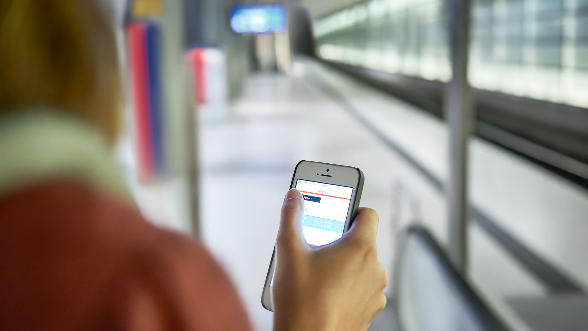 A person on the platform accesses the City Ticket on their smartphone.