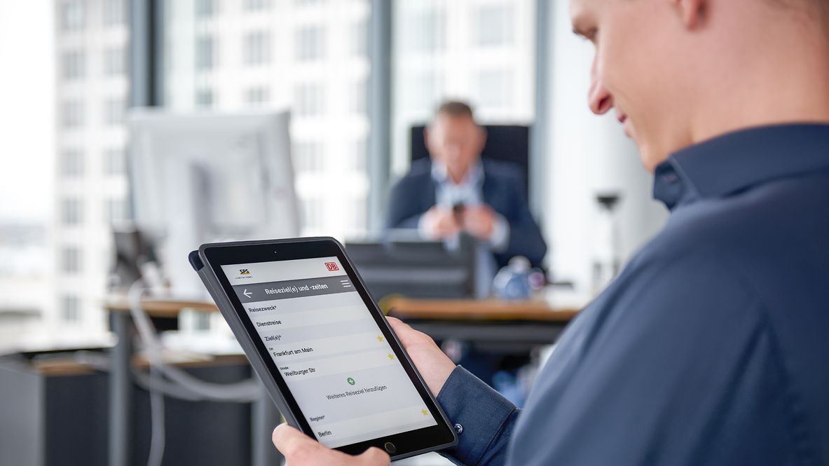 An employee communicates via a tablet. 