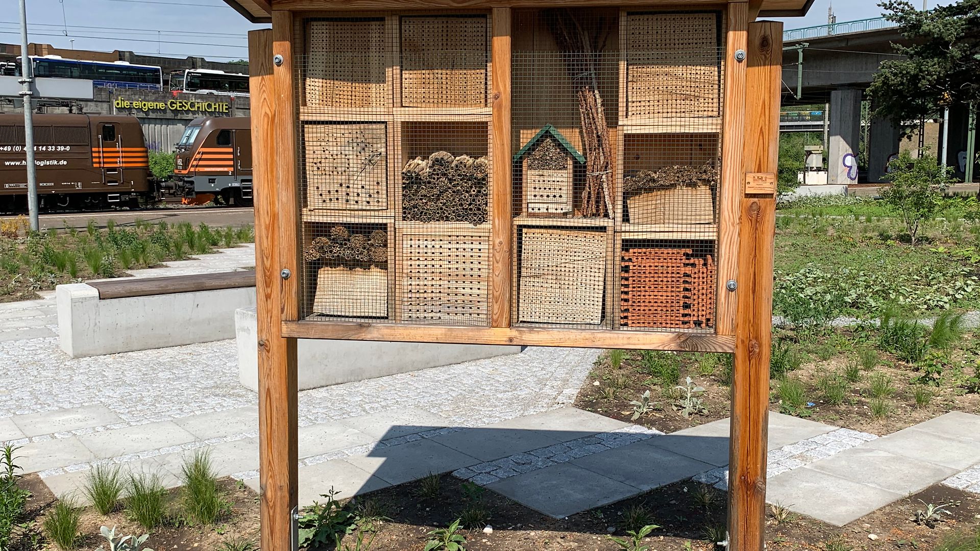 An insect hotel divided into different sections with retreat options