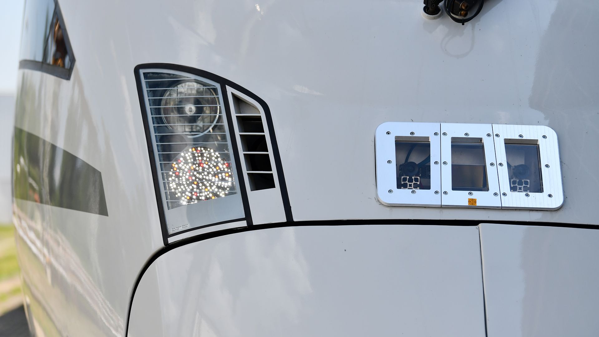 The front of a train highlighting der camera and radar system