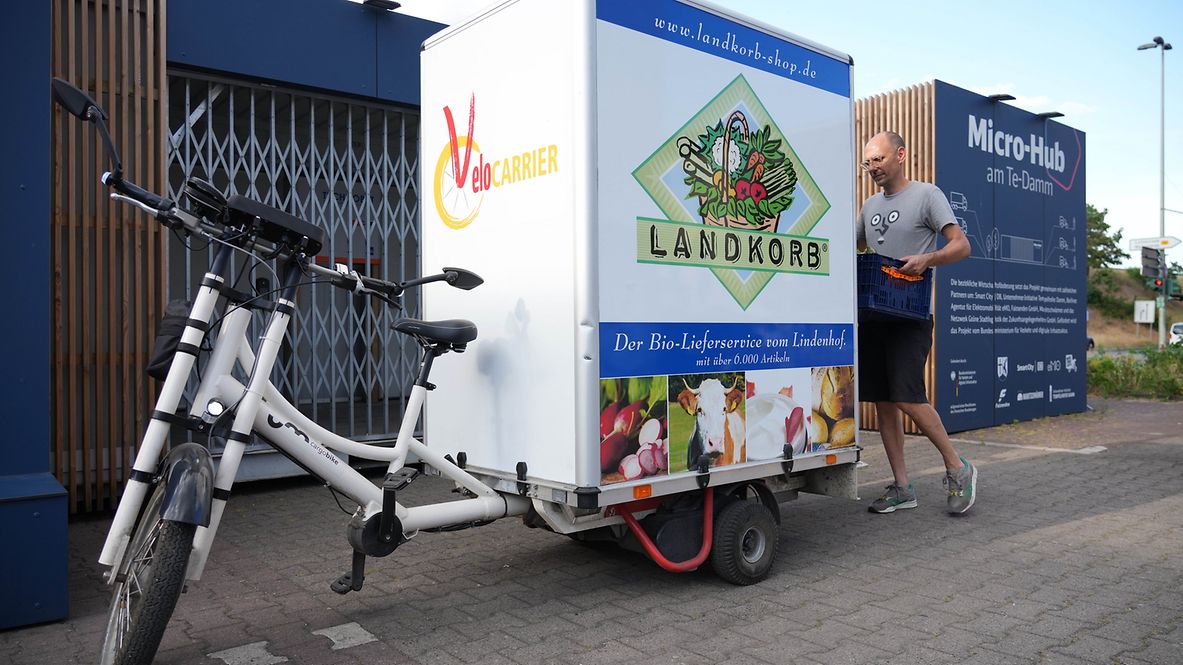 A man next to a Cargo bike at the Micro-Hub Te-Damm in Berlin.