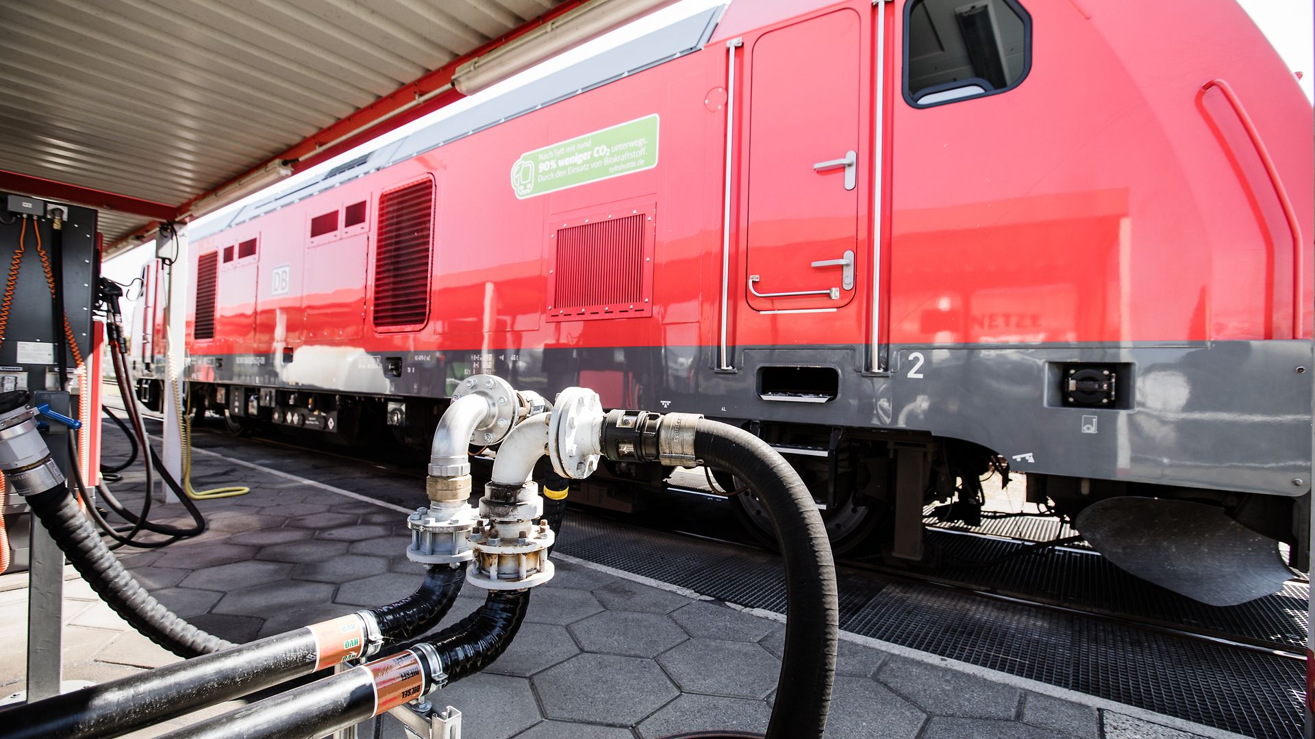 A red train is refueled at DB's HVO rail refueling station