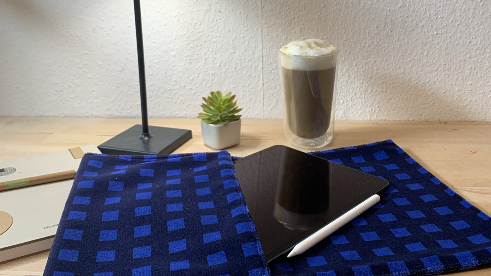 Desk with a tablet in a protective cover made from DB Regio seat cover materials